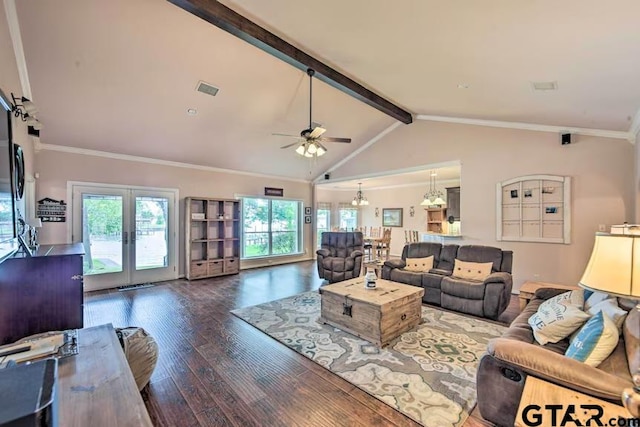 living room featuring lofted ceiling with beams, ceiling fan with notable chandelier, dark wood-type flooring, and a healthy amount of sunlight