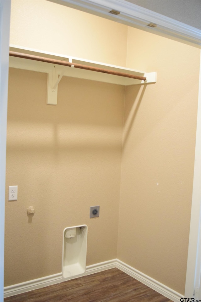 laundry area with hookup for an electric dryer and dark hardwood / wood-style flooring