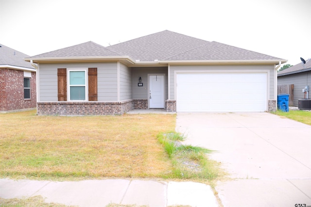 view of front of home featuring a garage and a front lawn