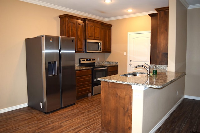 kitchen featuring kitchen peninsula, appliances with stainless steel finishes, light stone counters, and dark hardwood / wood-style flooring