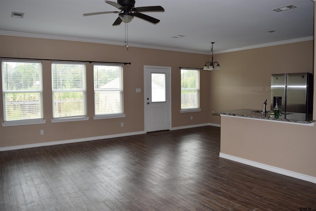 kitchen with decorative light fixtures, stainless steel fridge with ice dispenser, dark hardwood / wood-style floors, stone counters, and sink