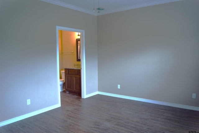 unfurnished room with ornamental molding and dark hardwood / wood-style floors