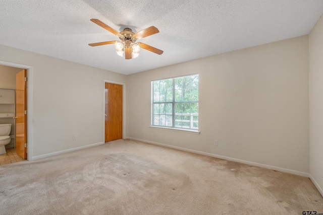 207 Pagosa Ln, Holly Lake Ranch, TX 75765 - unfurnished bedroom featuring baseboards, carpet flooring, and a textured ceiling