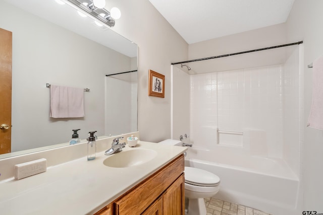 bathroom featuring  shower combination, vanity, and toilet