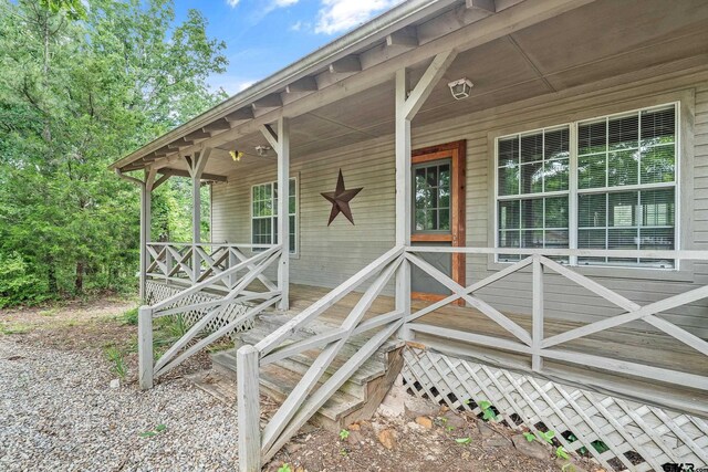 207 Pagosa Ln, Holly Lake Ranch, TX 75765 - entrance to property with covered porch