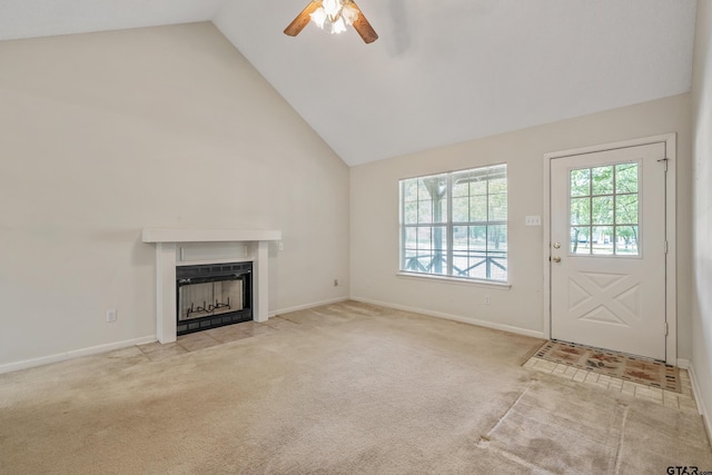 207 Pagosa Ln, Holly Lake Ranch, TX 75765 - unfurnished living room with ceiling fan, high vaulted ceiling, a fireplace with flush hearth, carpet floors, and baseboards
