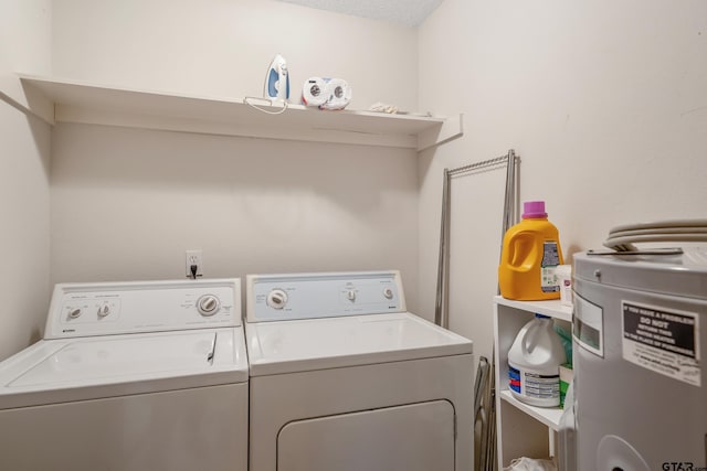 clothes washing area with laundry area and separate washer and dryer