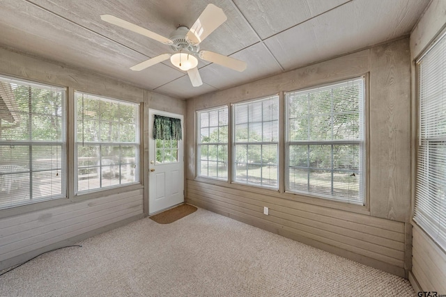 207 Pagosa Ln, Holly Lake Ranch, TX 75765 - unfurnished sunroom with wooden walls and carpet