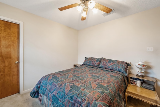 bedroom with visible vents, ceiling fan, light carpet, and baseboards