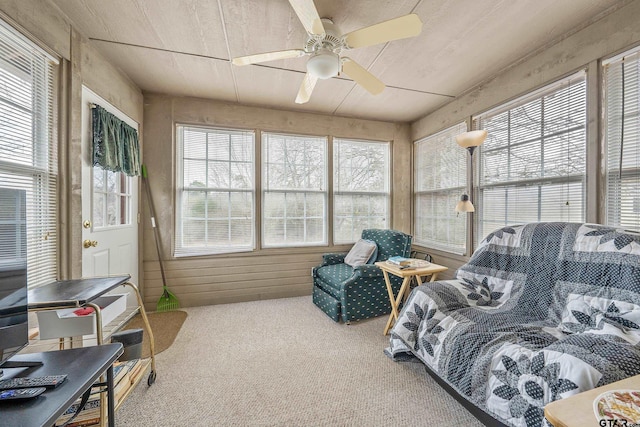 sunroom featuring ceiling fan