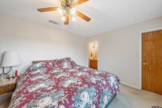 carpeted bedroom featuring baseboards, visible vents, and ceiling fan