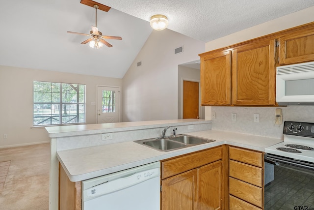 207 Pagosa Ln, Holly Lake Ranch, TX 75765 - kitchen featuring white appliances, a sink, a peninsula, light countertops, and a ceiling fan