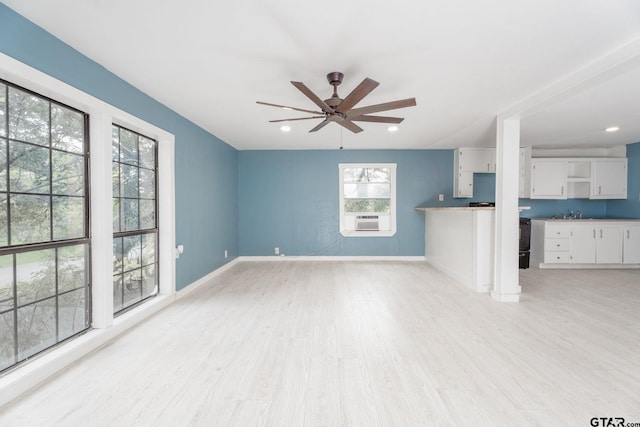 1910 E Lake St, Tyler, TX 75701 - unfurnished living room with light wood finished floors, a ceiling fan, cooling unit, and recessed lighting