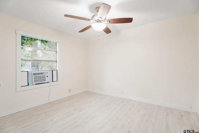 1910 E Lake St, Tyler, TX 75701 - spare room featuring wood finished floors, cooling unit, and ceiling fan