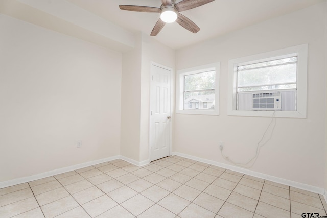 1910 E Lake St, Tyler, TX 75701 - spare room featuring cooling unit, ceiling fan, and light tile patterned flooring