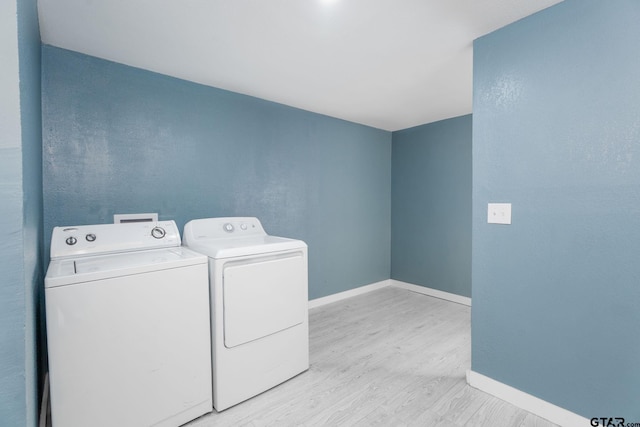 1910 E Lake St, Tyler, TX 75701 - washroom with washer and clothes dryer and light wood-style floors