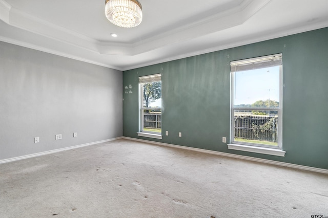 904 Van Winkle Cir, Athens, TX 75751 - carpeted empty room with a raised ceiling, ornamental molding, a chandelier, and baseboards