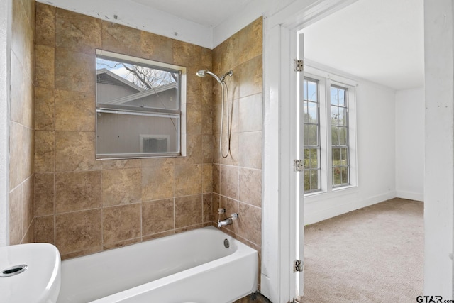 full bath featuring baseboards and shower / bathtub combination