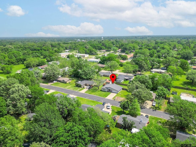 bird's eye view with a residential view and a wooded view