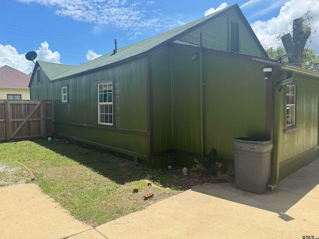 view of home's exterior with a lawn