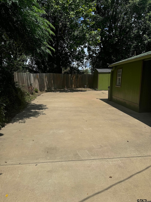 view of patio / terrace with a storage shed