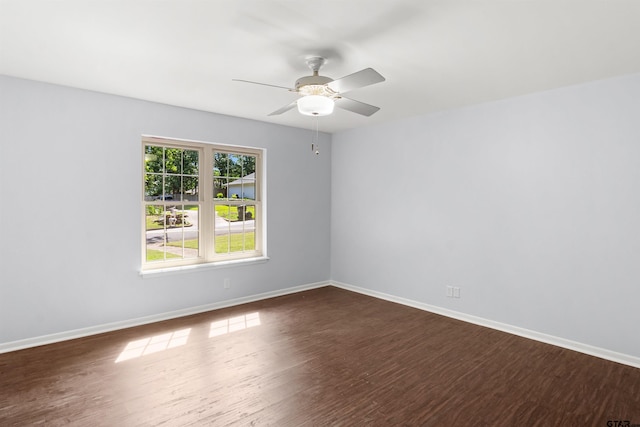 unfurnished room with ceiling fan and dark hardwood / wood-style floors