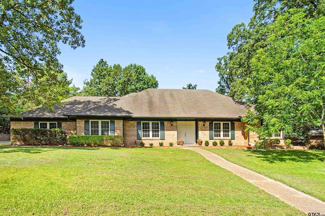 ranch-style home with a front lawn