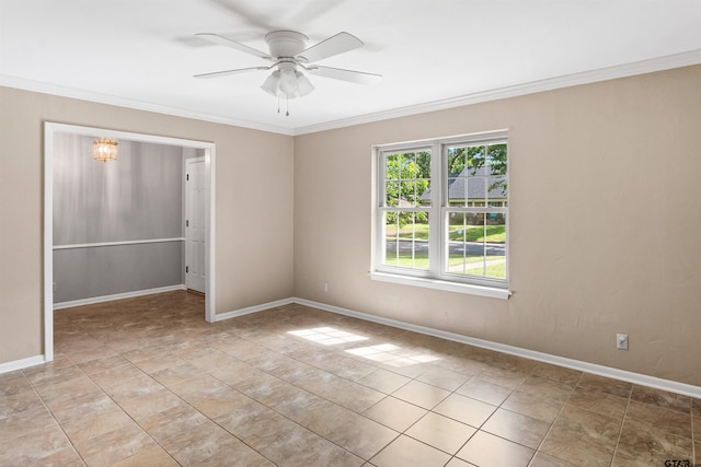 unfurnished room featuring ceiling fan and crown molding