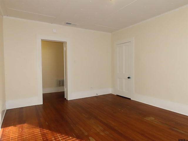 unfurnished room featuring dark hardwood / wood-style flooring