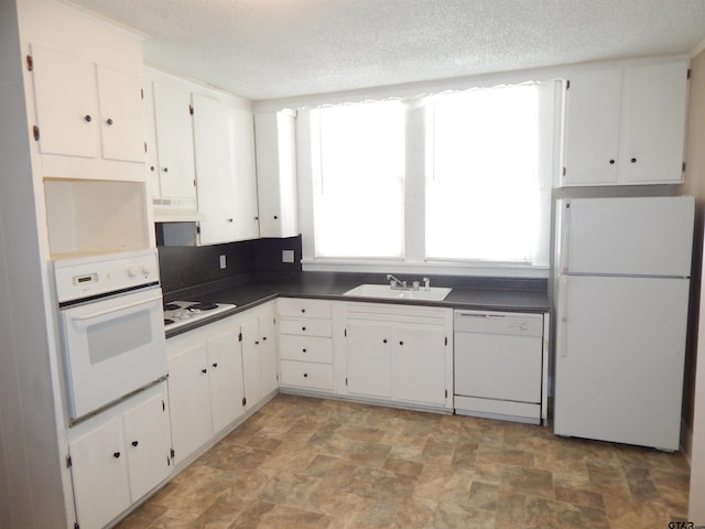 kitchen featuring ventilation hood, white cabinetry, white appliances, and sink