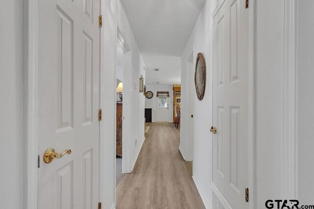 226 Circle Ridge Dr, Gilmer, TX 75645 - hallway with light wood finished floors and baseboards
