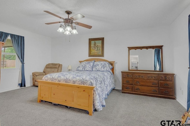 226 Circle Ridge Dr, Gilmer, TX 75645 - bedroom with carpet, baseboards, a textured ceiling, and a ceiling fan