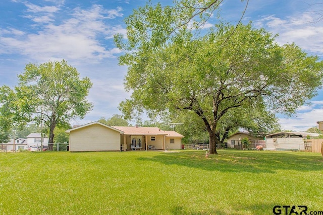 226 Circle Ridge Dr, Gilmer, TX 75645 - view of yard featuring a carport and french doors
