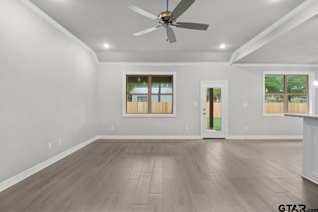 unfurnished room featuring ceiling fan, ornamental molding, and hardwood / wood-style flooring