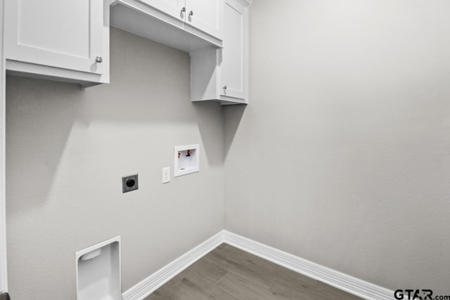 laundry room featuring cabinets, washer hookup, dark wood-type flooring, and hookup for an electric dryer