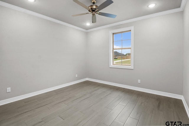 empty room with ceiling fan, light hardwood / wood-style floors, and crown molding