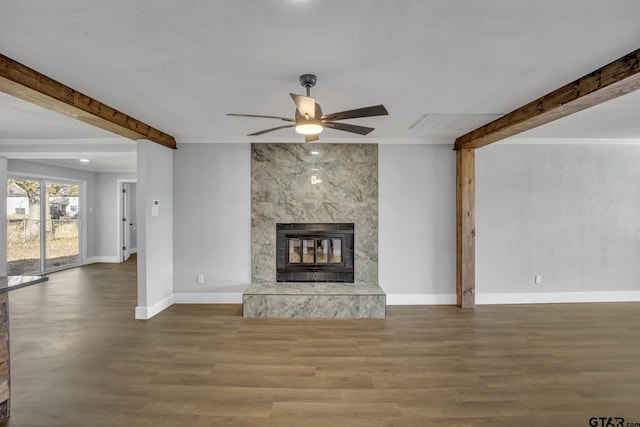 unfurnished living room with crown molding, hardwood / wood-style flooring, a high end fireplace, and ceiling fan