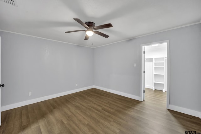 unfurnished room featuring hardwood / wood-style flooring, ornamental molding, and ceiling fan