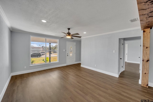 unfurnished living room featuring crown molding, ceiling fan, dark hardwood / wood-style floors, and a textured ceiling