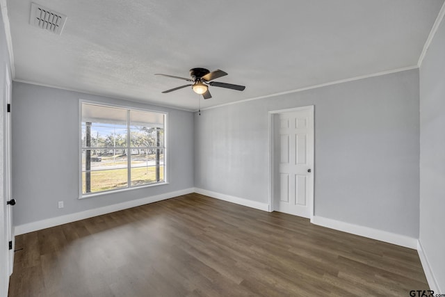 empty room with crown molding, ceiling fan, and dark wood-type flooring