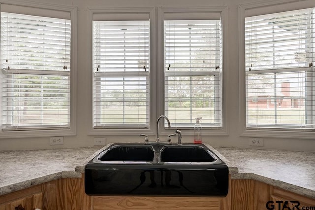 kitchen with light countertops and a sink