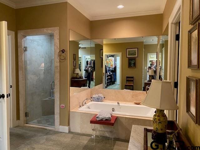 bathroom featuring a bath, a shower stall, and ornamental molding