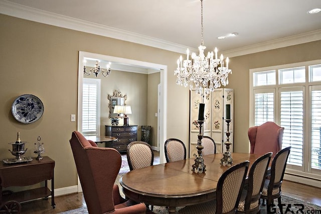 dining area featuring baseboards, wood finished floors, plenty of natural light, and ornamental molding