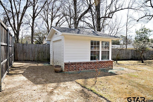 view of outbuilding featuring an outdoor structure and a fenced backyard