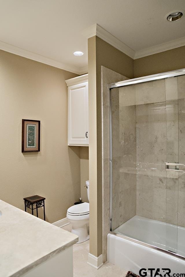 full bath with baseboards, toilet, ornamental molding, and vanity