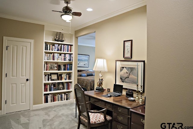 office space featuring carpet flooring, a ceiling fan, and ornamental molding