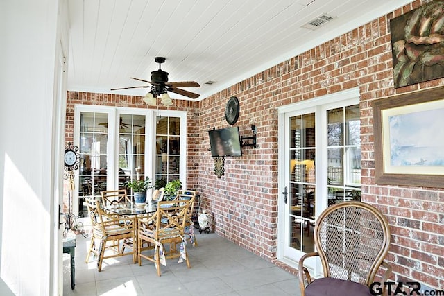 view of patio featuring a ceiling fan, visible vents, and french doors