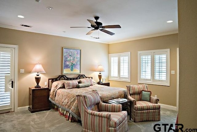 carpeted bedroom featuring recessed lighting, visible vents, baseboards, and ornamental molding