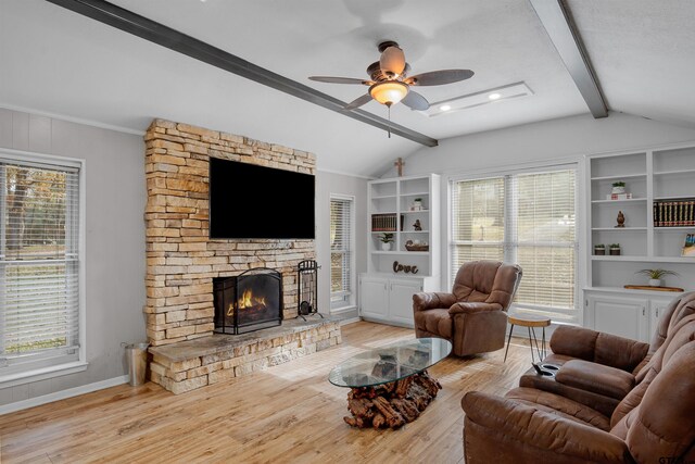 living room with built in shelves, vaulted ceiling with beams, a fireplace, light wood-style flooring, and baseboards