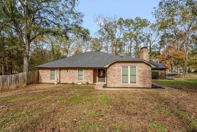 ranch-style house with a front lawn